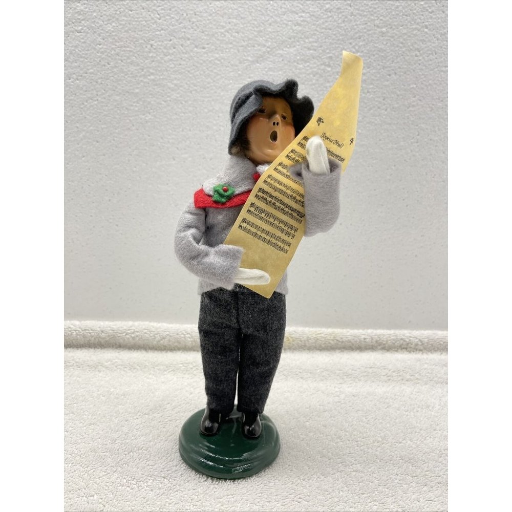 Byers choice caroler holding carol paper Signed